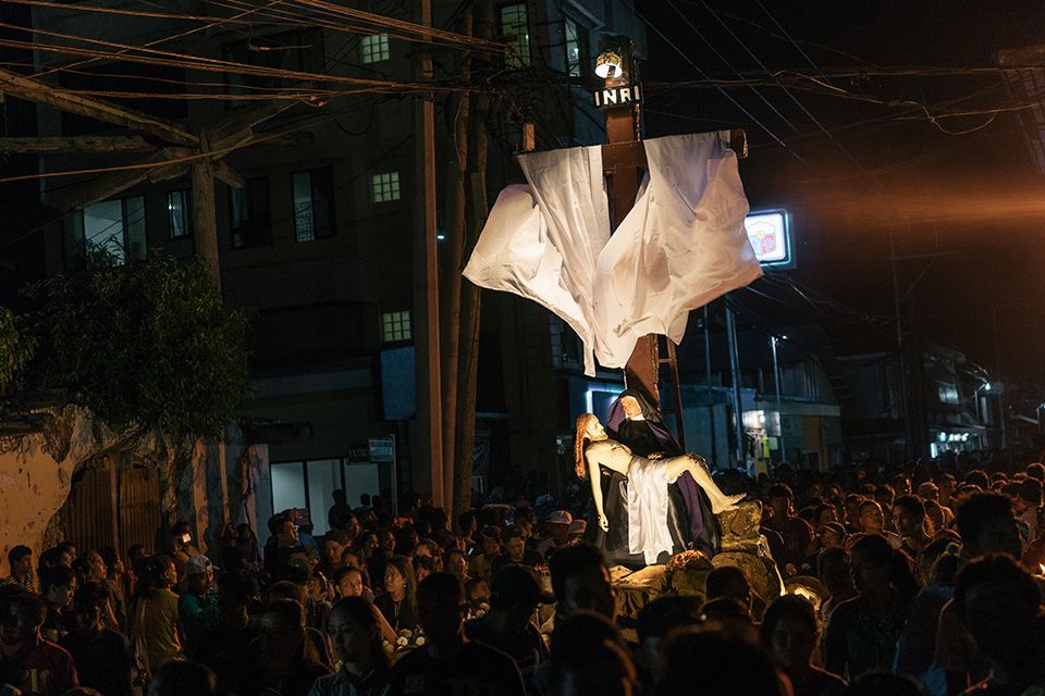 The Pieta caroza passing through the crowd during the Holy Week procession.